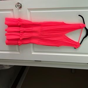 orange mini dress with shoulder detail and ruffle bottom